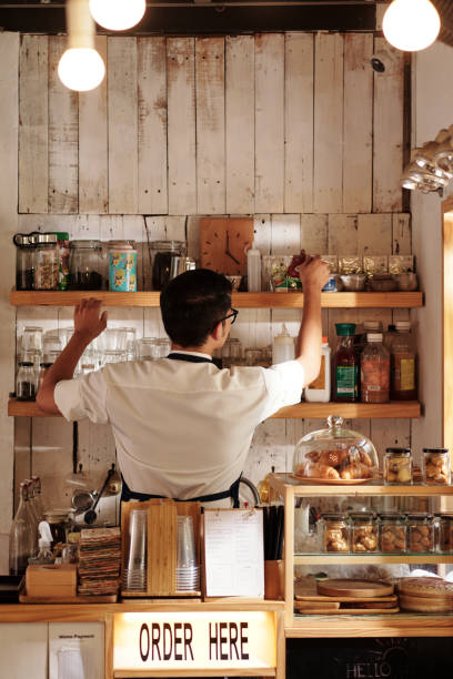 istock Cafe Barista Cleaning up Shelves 1428050773