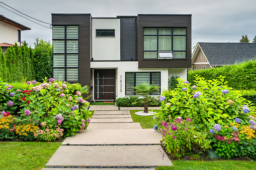 New house in the West Vancouver district of Vancouver BC Canada on a cloudy day.