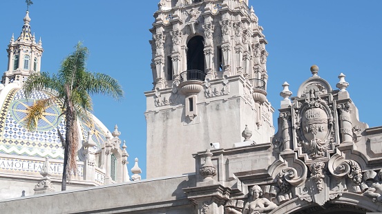 Spanish colonial revival architecture in Balboa Park, San Diego, California USA. Historic building, classic baroque or rococo romance style. Bell tower or belfry relief decor and mosaic dome or cupola