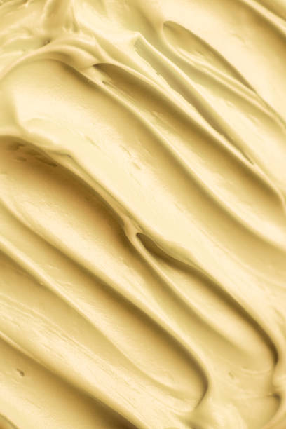 istock Yellow icing frosting close up texture 1428058897