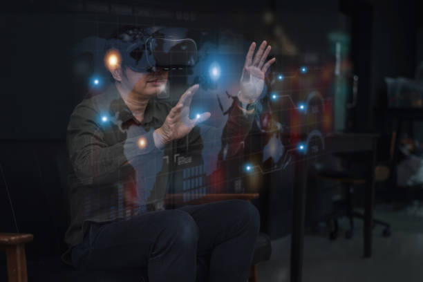 istock Innovation concept of the future Inventing technology, young men use VR HeadSet to open up modern experiences. Enjoy the virtual world Learning Artificial Intelligence or AI with a Smart Home 1428059281