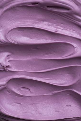 Purple icing frosting close up texture