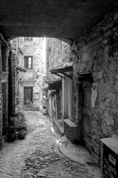 Apricale, Liguria, Italy: old alley. Black and white photo stock photo