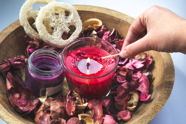 istock Composition with burning aroma candles among rose petals. 1428069387