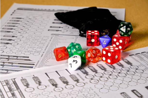 istock Several role-playing game dice with a role-playing character token. 1428072880