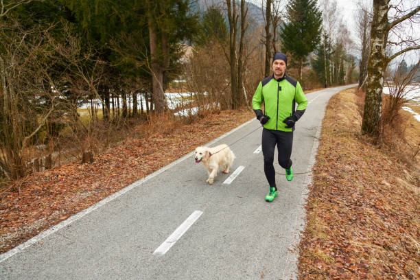 istock Running with dog in winter 1428073576