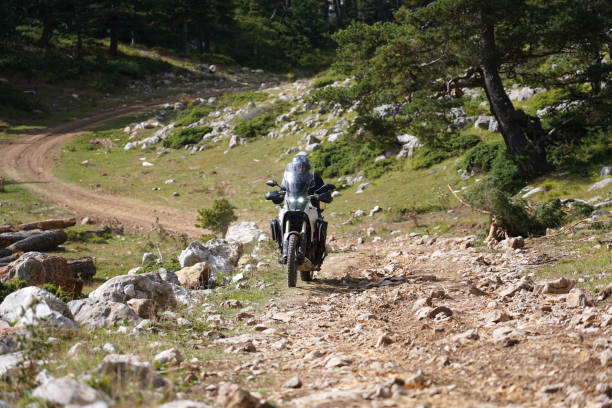 istock A man riding an off-road motorcycle on a mountain road 1428081387