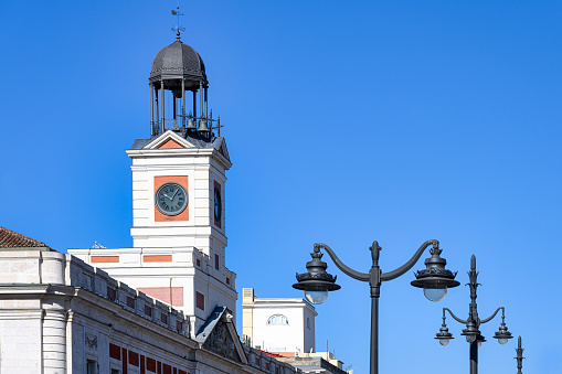 Madrid, Spain, Decorative street light and clock tower