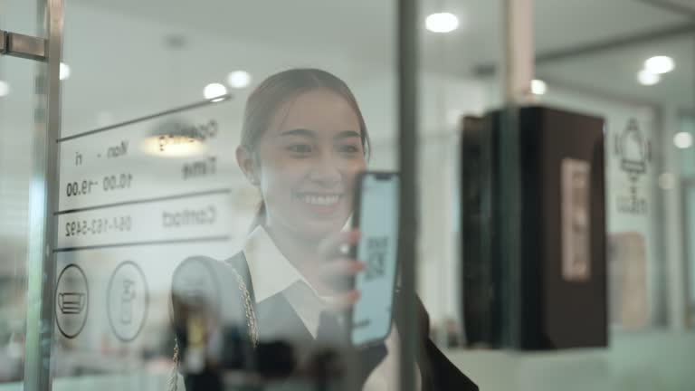 Successful asian business woman walking in office happily.