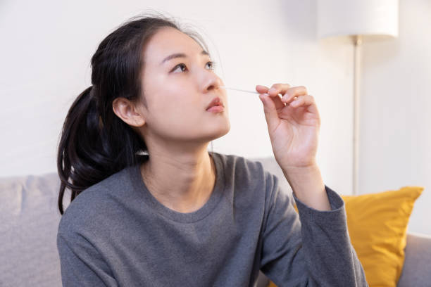 istock Woman Using Rapid Antigen Test Kit (ATK) for Covid-19 Virus Self Test at Home 1428085335