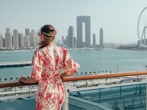 Fashionable woman standing on the empty deck Fashionable woman standing on the empty deck of a cruise liner against the backdrop of the setting sun. Closeup, outdoor. Vacation and travel concept arabian sunglasses stock pictures, royalty-free photos & images