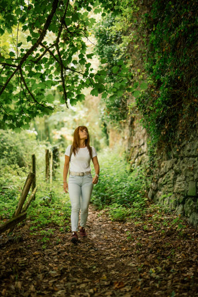 istock woman hiking on a hidden trail 1428085526