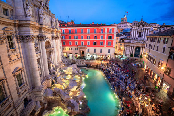 Rome, Italy overlooking Trevi Fountain during twilight.