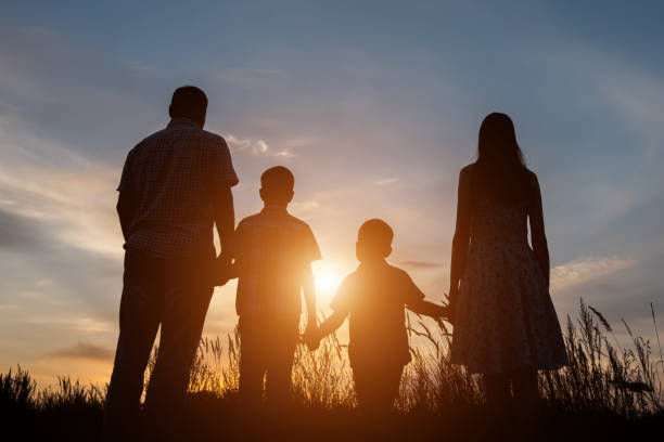 istock Family standing among fields spends holidays in countryside 1428087092