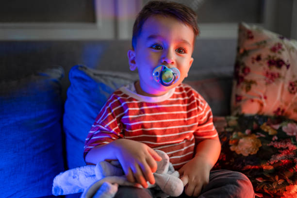 istock Baby boy watching cartoon before sleeping time 1428088166