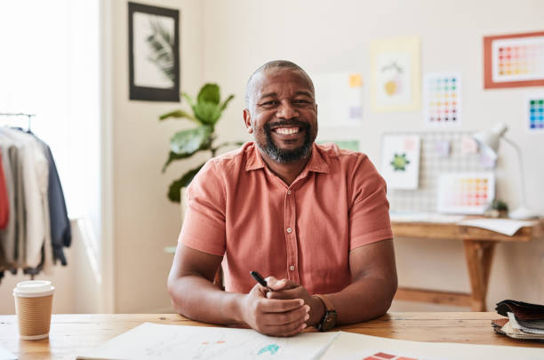 istock Design, man and portrait of drawing work desk brainstorming session in creative studio. Creative illustration artist or fashion designer person doing paper mood board for business idea. 1428088180
