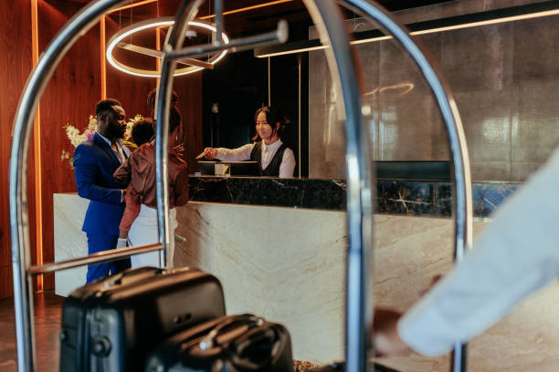 istock Hotel guests with baggage cart 1428092689