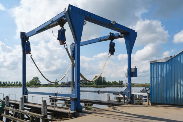 istock Boat travel lift in harbor under a blue sky with large clouds 1428094100