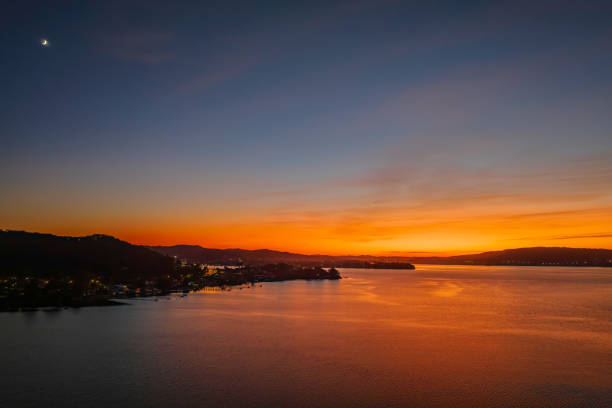 istock Aerial sunrise waterscape with boats and high cloud 1428096458