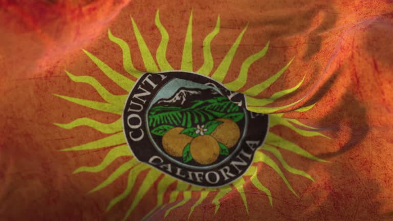 Old flag of Orange county, state of California, United States - loop