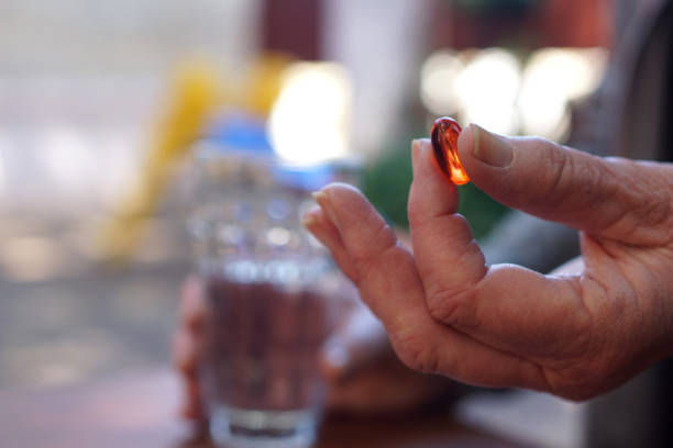 istock woman taking a pill outdoors 1428100035