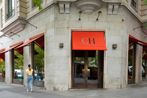 Madrid, Spain, September 2022. view of the Carolina Herrera brand sign out of the fashion store in the city center
