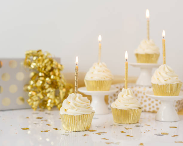 istock Birthday Candles on Vanilla Cupcakes 1428104941