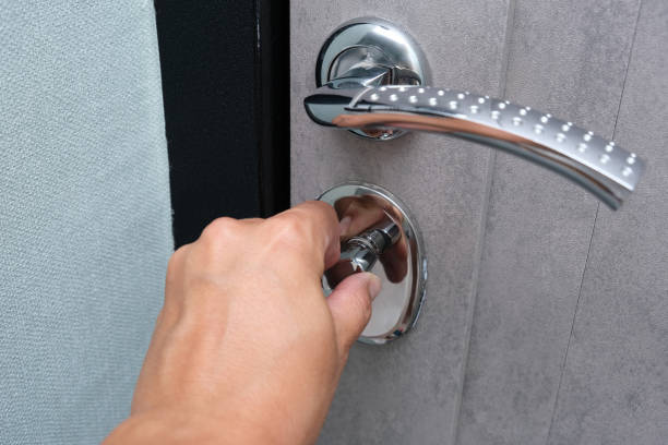 istock A hand locking the door with a door knob for security, protection from robbery and theift 1428110586