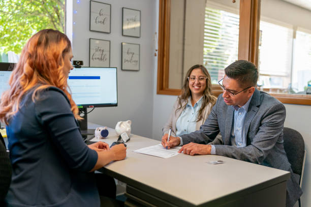 istock Hispanic couple signing legal documents 1428112992
