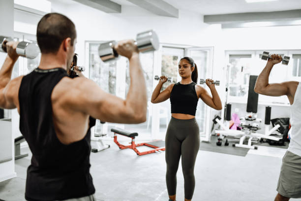 istock Good Workout Form By Instructor And Athletes In Gym 1428113369