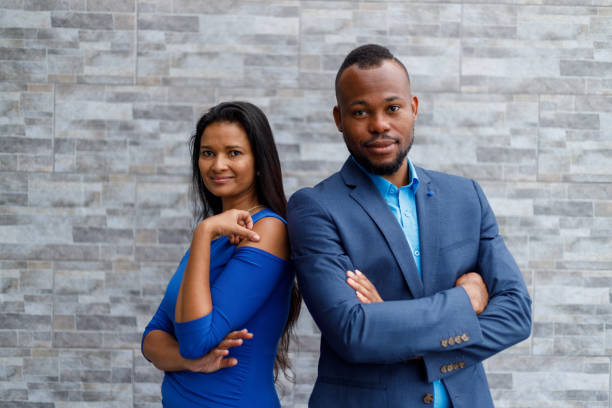 istock Happy colleagues with arms crossed standing outside office 1428114542