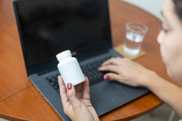 istock Woman looking up medication information on a laptop 1428121218