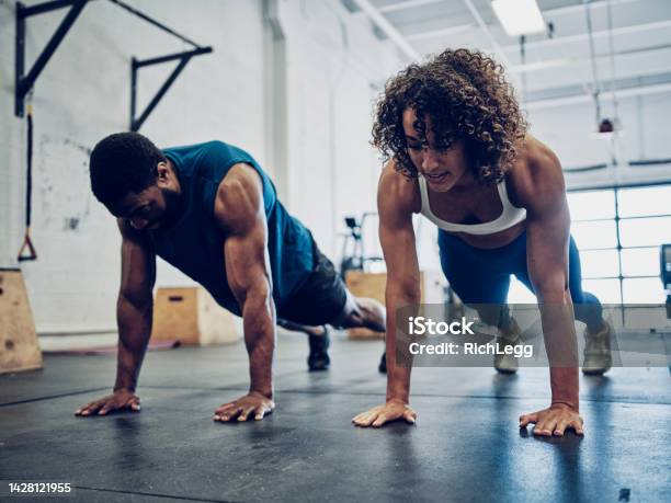 Two People Cross Training In A Gym Stock Photo - Download Image Now - Fitness Instructor, Athlete, Muscular Build