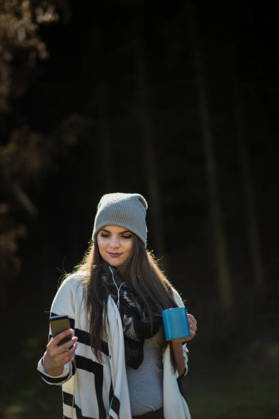 istock Woman taking selfie  in nature forest 1428128668