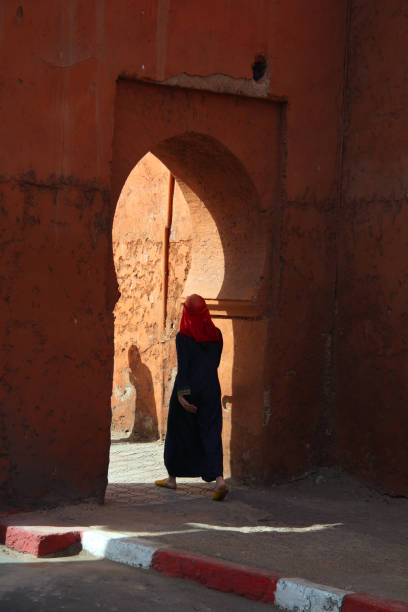 istock Woman walking with traditional clothing, Marrakech, Morocco 1428129919