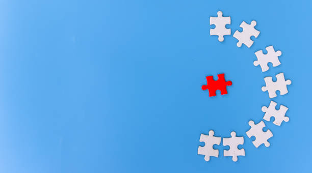 istock jigsaw puzzle pieces on blue background, Team business concept 1428131610