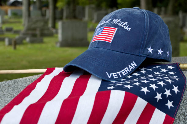 istock American Veterans cap on flag and grave marker 1428132437