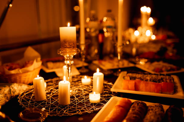 istock table with burning candles and food 1428132456