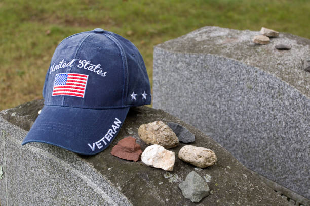 Veteran’s cap on grave markers in Jewish cemetery.