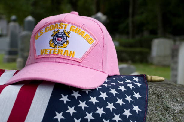istock US Coast Guard female Veterans cap on flag in cemetery 1428132494