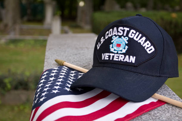 istock US Coast Guard Veterans cap on flag and grave marker 1428132519