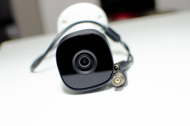 istock CCTV videocam, CFTV security camera, white camera with secure circuit, theft protection. Surveillance view. Camera lens, sensor and infrared. 1428140167