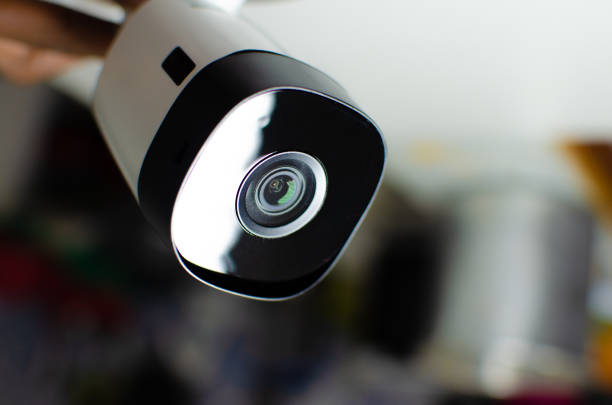 istock CCTV videocam, CFTV security camera, white camera with secure circuit, theft protection. Surveillance view. Camera lens, sensor and infrared. 1428140225