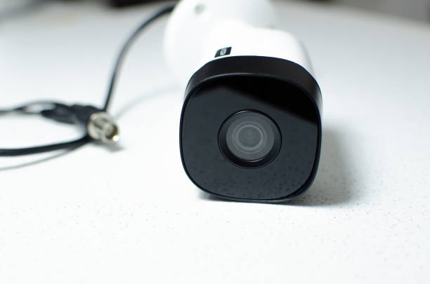 istock CCTV videocam, CFTV security camera, white camera with secure circuit, theft protection. Surveillance view. Camera lens, sensor and infrared. 1428140244