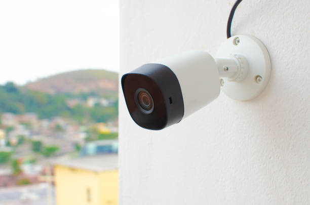 istock Video Camera CCTV, CFTV security camera, white wall camera, safely recording the external environment in a busy place. Safe circuit, theft protection. Surveillance view. 1428149373