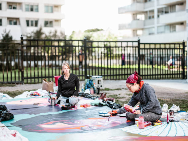 istock Two Young female artists creating outdoor mural 1428150781