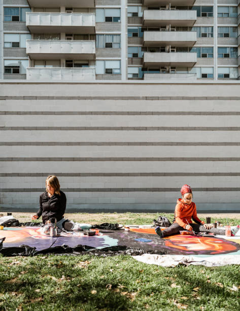 istock Two Young female artists creating outdoor mural 1428150943