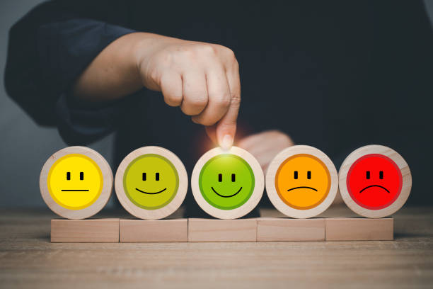 istock Customer select smile face emoticon for rating. Service rating, feedback, satisfaction concept. Customer service best excellent. 1428157206
