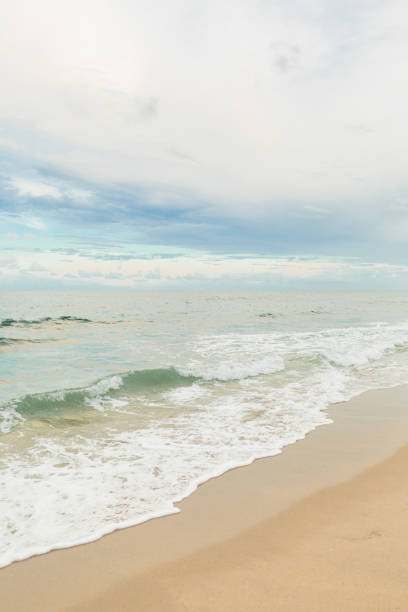 istock Bright Blue Cloudy Sky Over a Teal Ocean Waves Sweeping Across the Highland Beach, Florida Seashore in September of 2022 1428157731