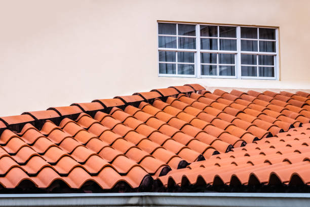 Roof  terracotta clay tiles house red  tiled rooftop and guttering stock photo